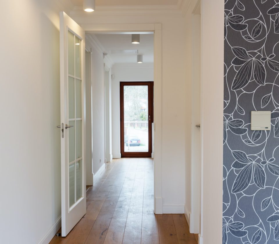 Bright hallway with wooden flooring