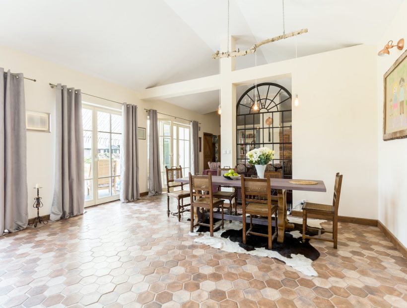 Spacious dining room with rustic tiles